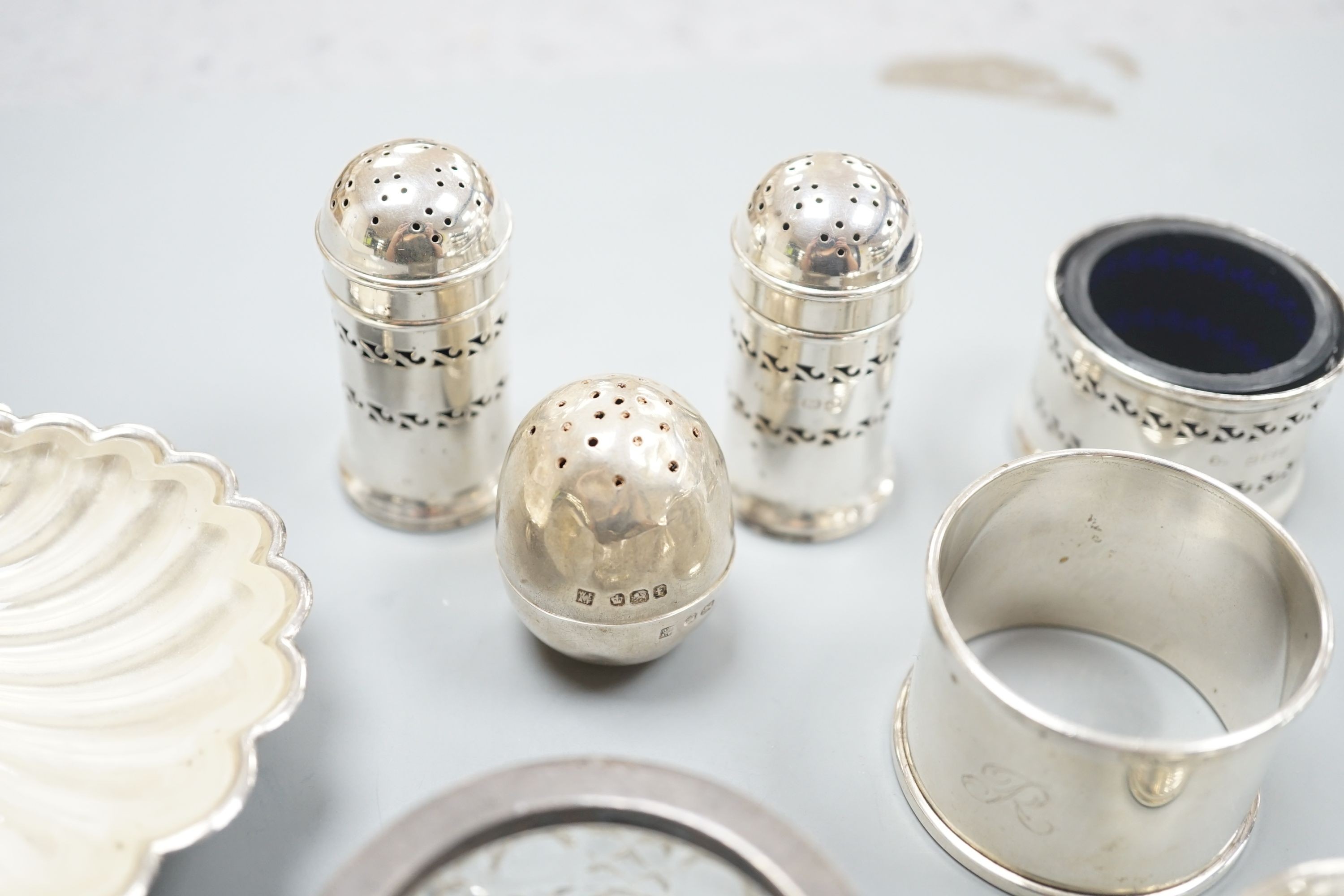Five assorted silver condiments, napkin ring and silver shell dish with glass liner, etc